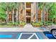 Building entrance featuring meticulously landscaped grounds, accessible parking and building number at 6519 Grand Estuary Trl # 107, Bradenton, FL 34212