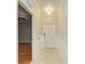 Welcoming entryway with decorative wainscoting, tile flooring, and a view into the adjacent room at 6519 Grand Estuary Trl # 107, Bradenton, FL 34212