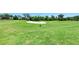Well-manicured golf course with lush green grass and a sand bunker at 6519 Grand Estuary Trl # 107, Bradenton, FL 34212