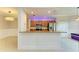 Bright open kitchen featuring granite countertops, stainless steel appliances, and a breakfast bar at 6519 Grand Estuary Trl # 107, Bradenton, FL 34212