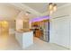 Bright open kitchen featuring granite countertops, stainless steel appliances, and an island with seating at 6519 Grand Estuary Trl # 107, Bradenton, FL 34212