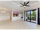 Spacious living area with modern fan, and seamless flow to the outdoors at 6519 Grand Estuary Trl # 107, Bradenton, FL 34212