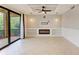 Living room with coffered ceilings, modern fan and seamless flow to the outdoors at 6519 Grand Estuary Trl # 107, Bradenton, FL 34212