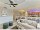 Bright living room featuring modern furniture, neutral decor, and open access to dining and kitchen areas at 6519 Grand Estuary Trl # 107, Bradenton, FL 34212