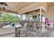 Inviting outdoor bar area with granite countertops and comfortable seating at 6519 Grand Estuary Trl # 107, Bradenton, FL 34212