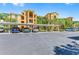 Well-maintained parking area with covered spaces in front of the residential building at 6519 Grand Estuary Trl # 107, Bradenton, FL 34212
