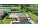 Community pool with a covered pavilion, a seating area, and a view of the lake and the golf course at 6519 Grand Estuary Trl # 107, Bradenton, FL 34212
