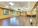 Bright and spacious yoga studio with hardwood floors, large windows, and mirrors for a rejuvenating fitness experience at 6519 Grand Estuary Trl # 107, Bradenton, FL 34212