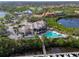 Expansive aerial view of community clubhouse, pool, marina, and beautifully landscaped surroundings at 661 Foggy Morn Ln, Bradenton, FL 34212