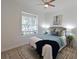 Bright bedroom with a plush bed, stylish rug, and a view from the window with plenty of natural light at 661 Foggy Morn Ln, Bradenton, FL 34212