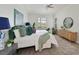 Bright bedroom featuring a ceiling fan, comfortable Queen bed, and natural light at 661 Foggy Morn Ln, Bradenton, FL 34212