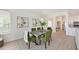 Elegant dining room with a modern table, seating for six, and stylish decor at 661 Foggy Morn Ln, Bradenton, FL 34212