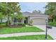 Beautiful single-story home with well-maintained landscaping, a two-car garage, and a welcoming entrance at 661 Foggy Morn Ln, Bradenton, FL 34212