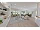 Spacious living room featuring an open layout, stylish decor, and plenty of natural light at 661 Foggy Morn Ln, Bradenton, FL 34212
