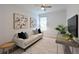 Cozy home office with a comfortable sofa, desk, and a bright window view at 661 Foggy Morn Ln, Bradenton, FL 34212