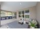 Comfortable patio with outdoor seating, grill, and bar area with a view of the backyard at 661 Foggy Morn Ln, Bradenton, FL 34212
