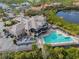Aerial view of the clubhouse pool, amenities, and waterfront location at 661 Foggy Morn Ln, Bradenton, FL 34212