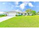 Charming single-story home with a two car garage, well-manicured lawn, and mature landscaping at 6627 Heritage Ln, Bradenton, FL 34209