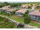 A serene backyard view of a screened-in patio, lush landscaping, and a tranquil pond at 6764 Hickory Hammock Cir, Bradenton, FL 34202