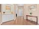 Spacious entryway with tile floors leading to an open floor plan and decorative console table at 6764 Hickory Hammock Cir, Bradenton, FL 34202