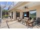 Spacious screened-in lanai with outdoor seating and access to indoor living space with scenic outdoor views at 6764 Hickory Hammock Cir, Bradenton, FL 34202