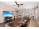 Open living space with wood floors, a TV, a dining table, and access to other areas of the home at 6764 Hickory Hammock Cir, Bradenton, FL 34202