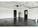 Clean and spacious garage with epoxy flooring, water heater, and ample storage space at 7 Arbor Oaks Dr, Sarasota, FL 34232