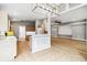 Open concept kitchen with tile floors, modern lighting, and an eat-in breakfast bar at 7 Arbor Oaks Dr, Sarasota, FL 34232