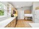 Eat-in kitchen features stainless steel appliances, quartz countertops, and storage at 7 Arbor Oaks Dr, Sarasota, FL 34232