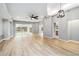 Bright and open-concept living room with wood floors and plenty of space for entertaining at 7 Arbor Oaks Dr, Sarasota, FL 34232