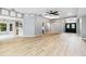 Bright and open-concept living room with wood floors and plenty of space for entertaining at 7 Arbor Oaks Dr, Sarasota, FL 34232