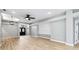 Bright and open-concept living room with wood floors and plenty of space for entertaining at 7 Arbor Oaks Dr, Sarasota, FL 34232