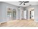 Bright main bedroom with walk-in closet and sliding glass doors to the sunroom at 7 Arbor Oaks Dr, Sarasota, FL 34232