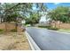 Picturesque entrance to Arbor Oaks featuring brick signage and lush greenery at 7 Arbor Oaks Dr, Sarasota, FL 34232