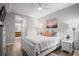 Cozy bedroom with a ceiling fan, natural light, hardwood floors, and stylish decor at 7005 River Hammock Dr # 206, Bradenton, FL 34212