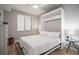 This bedroom features a ceiling fan and a Murphy bed at 7005 River Hammock Dr # 206, Bradenton, FL 34212
