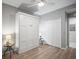 This bedroom has hard wood floors, a ceiling fan, a Murphy bed, and a closet at 7005 River Hammock Dr # 206, Bradenton, FL 34212