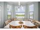 Inviting breakfast nook with a bay window, comfortable bench seating, and natural light at 7005 River Hammock Dr # 206, Bradenton, FL 34212