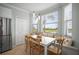 Cozy breakfast nook featuring a bay window, bench seating, and rustic-style chairs at 7005 River Hammock Dr # 206, Bradenton, FL 34212