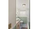 Bathroom featuring tiled floors, a single sink, and updated lighting at 720 S Green Cir, Venice, FL 34285