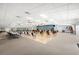 Large community event space with tables, chairs, a dance floor, and a stage at 720 S Green Cir, Venice, FL 34285