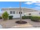 Charming single-story home showcasing a well-maintained exterior with a covered parking area and landscaped front yard at 720 S Green Cir, Venice, FL 34285