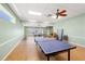 Spacious game room featuring a ping pong table and plenty of space for recreational activities at 720 S Green Cir, Venice, FL 34285