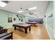 Game room with billiard tables and ample space for recreational activities at 720 S Green Cir, Venice, FL 34285
