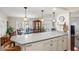 Eat-in kitchen boasts a large countertop, modern appliances, and a seamless flow to the dining and living areas at 720 S Green Cir, Venice, FL 34285