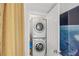 Convenient stacked washer and dryer in laundry area for easy chore days at 720 S Green Cir, Venice, FL 34285