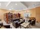 Cozy library with comfortable seating, bookshelves, and a table with a computer at 720 S Green Cir, Venice, FL 34285