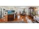 Open concept living room and kitchen offer a seamless entertaining space with stainless steel appliances and comfortable seating at 720 S Green Cir, Venice, FL 34285
