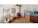 Cozy living room showcases an open floor plan to the kitchen, hardwood floors, and natural light streaming in at 720 S Green Cir, Venice, FL 34285