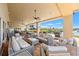 Luxurious outdoor patio with comfortable seating and scenic views of the waterfront at 720 S Green Cir, Venice, FL 34285